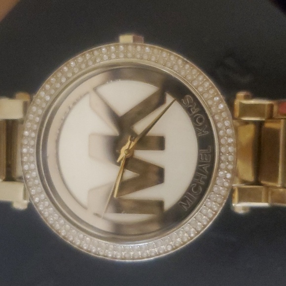 Ladies gold color MK logo watch,  rhinestone accent around dial